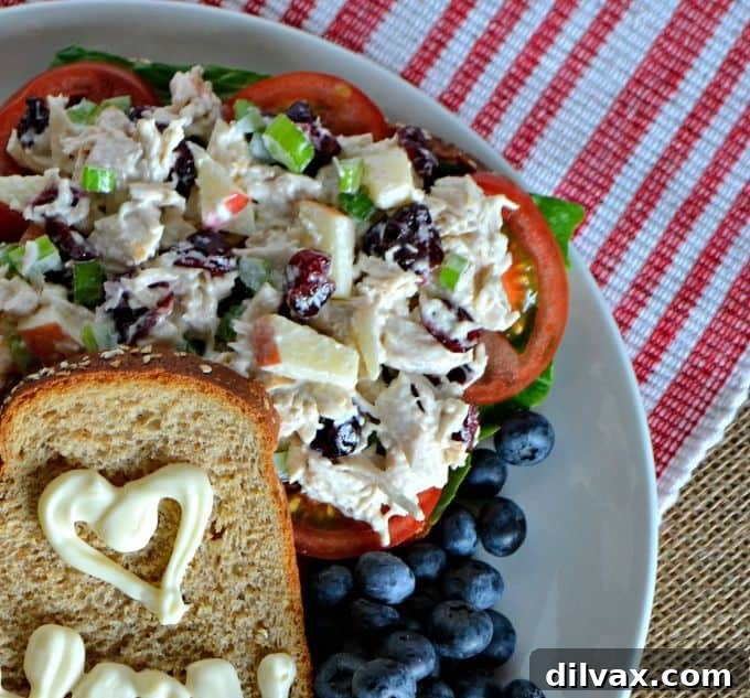 Cranberry Apple Chicken Salad sandwich with a sweet note written on the bread.