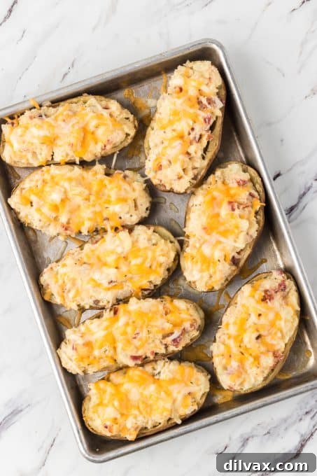 Decadent Potato Boats 6 Potatoes that have been baked and then baked again with all the fixins.