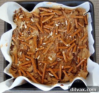 Pretzel sticks arranged on top of brownie batter