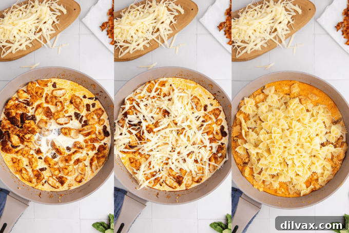 Second stage of Chicken Mozzarella Pasta preparation: cooked pasta added to creamy cheese sauce with sun-dried tomatoes and chicken, then garnished with basil and red pepper flakes.