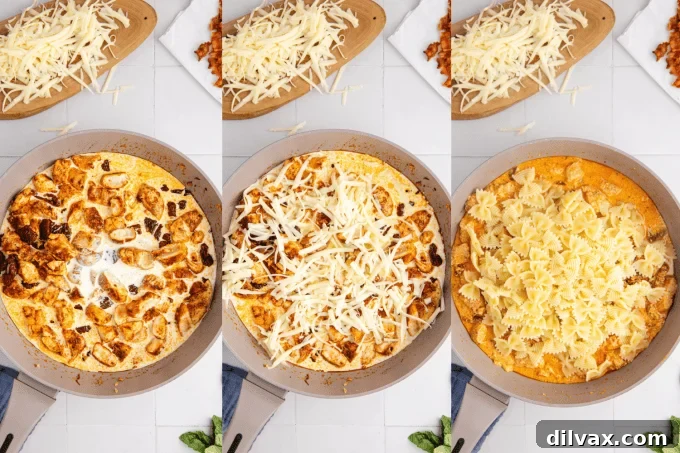 Melted Mozzarella Chicken Pasta 6 Close-up of Chicken Mozzarella Pasta being tossed in a skillet, showing the sauce coating the farfalle pasta.