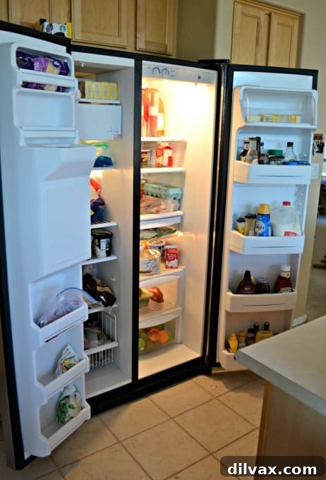 Well-maintained GE stove with pots and pans, ready for cooking a family meal