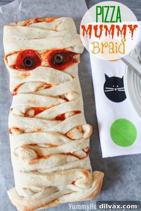 Savory Pizza Mummy Braid, perfect for a Halloween meal