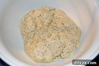 Fragrant Italian Herb & Cheese Loaf 2 Freshly baked Italian Herb and Cheese Bread loaf on a wooden board