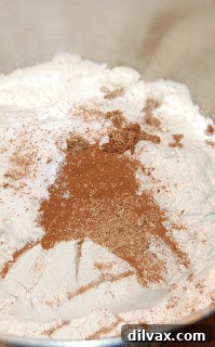 Day 28: Flu-Fighting Cookies 7 A bowl containing combined dry ingredients: flour, baking powder, baking soda, salt, cinnamon, nutmeg, and cloves.