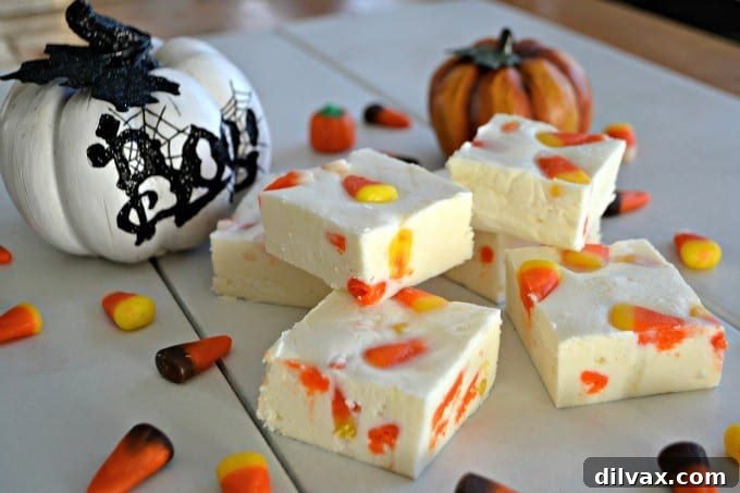 Creamy white chocolate fudge with vibrant candy corn pieces, capturing the essence of Fall.