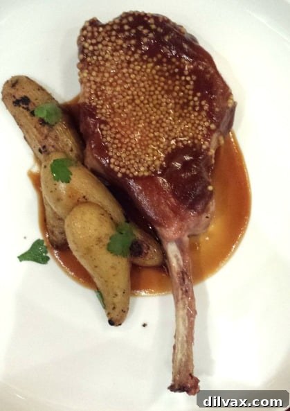 Crafting Porks Future A National Board Expedition 5 Juicy 10-ounce Duroc Tomahawk Chop with apple BBQ sauce and fingerling potatoes.