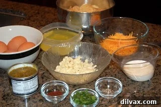 Day 21: Chile Cheese Casserole Magic 2 Various ingredients for Chile Cheese Casserole laid out on a counter, including eggs, egg whites, chiles, and cheese.