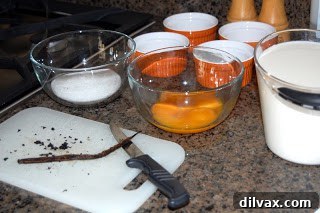 Fresh ingredients for making homemade Crème Brûlée Various ingredients laid out neatly for Crème Brûlée preparation
