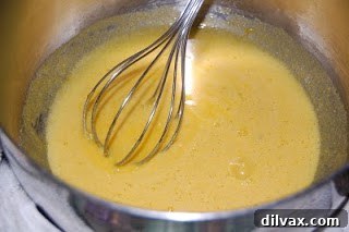 Egg yolks and vanilla sugar combined for Crème Brûlée custard base Whisked egg yolks and vanilla sugar mixture prepared for custard