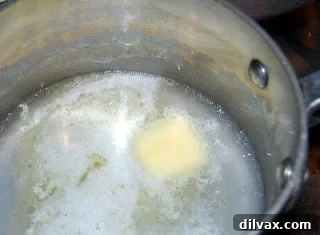 Day 16: Golden Corn Crisps 2 Water and butter boiling in a small pan