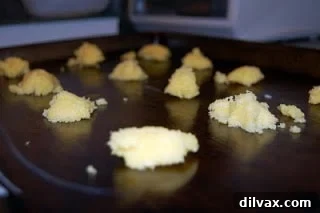 Day 16: Golden Corn Crisps 4 Teaspoonfuls of cornmeal mixture dropped onto a buttered cookie sheet