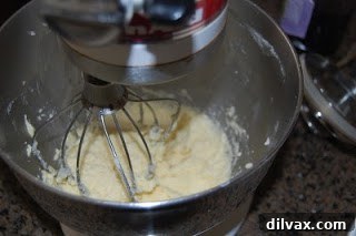 Creaming butter and sugar for sugar cookie dough.