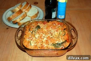 Homemade Impromptu Pasta Bake with melted cheese and vegetables, fresh from the oven, ready to serve.