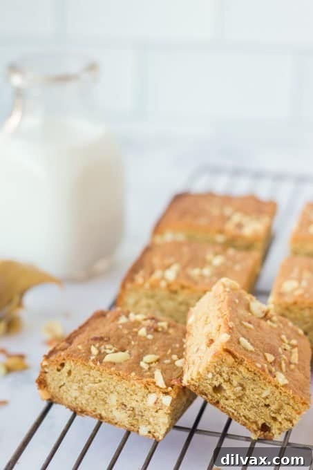Fudgy Peanut Butter Swirl Brownies 7 Perfectly cut squares of homemade peanut butter brownies, ready to be enjoyed.