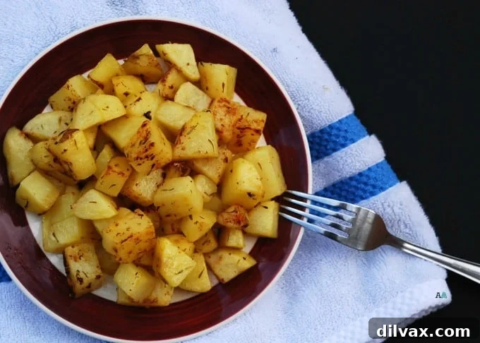 Crispy roasted potatoes seasoned with traditional Greek herbs like oregano and lemon, just like a diner.
