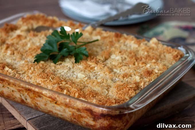 Barbara Bakes' Funeral Potatoes, a classic cheesy hash brown casserole, perfect for gatherings.