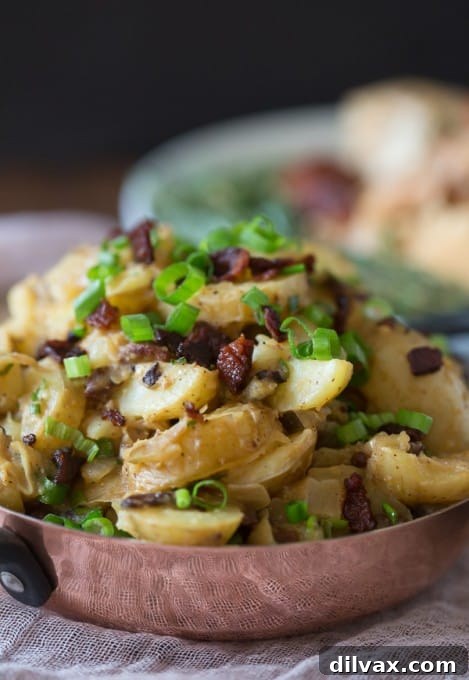 Delicious Warm Bacon Herb Potato Salad, a comforting and flavorful twist on the classic.