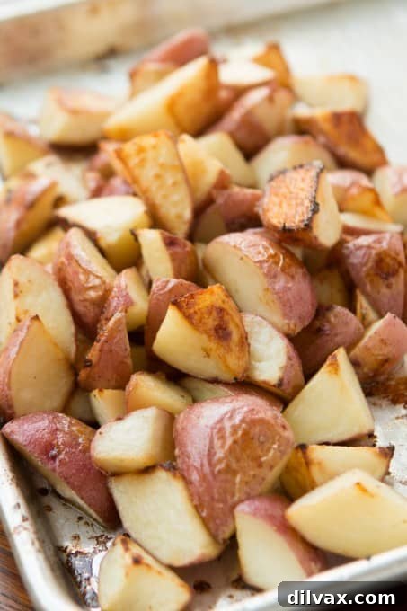 Roasted red potatoes glazed with a sweet and savory honey coating, creating caramelized deliciousness.