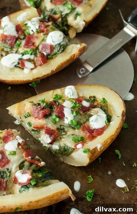 Crispy bacon, spinach, and artichoke loaded potato skins recipe by Peas & Crayons.