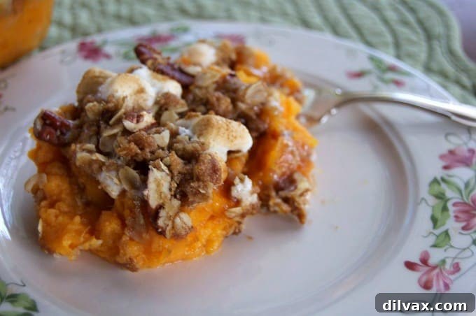 An incredibly delicious Maple Sweet Potato Casserole, where maple syrup enhances the natural sweet potato flavor, topped with an irresistible brown sugar and oat crumble. Don't forget the fluffy marshmallows for the ultimate holiday treat!