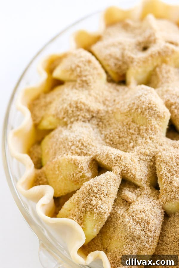 Effortless Apple Cream Dream 2 Cinnamon sugar on top of apples in a pie.