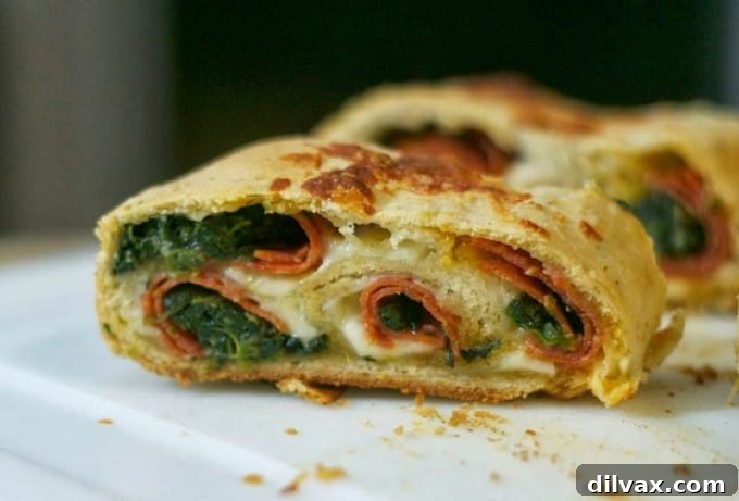 A loaf of Spinach Pepperoni Bread, a delicious twist on the classic, incorporating fresh spinach for added flavor and nutrition.