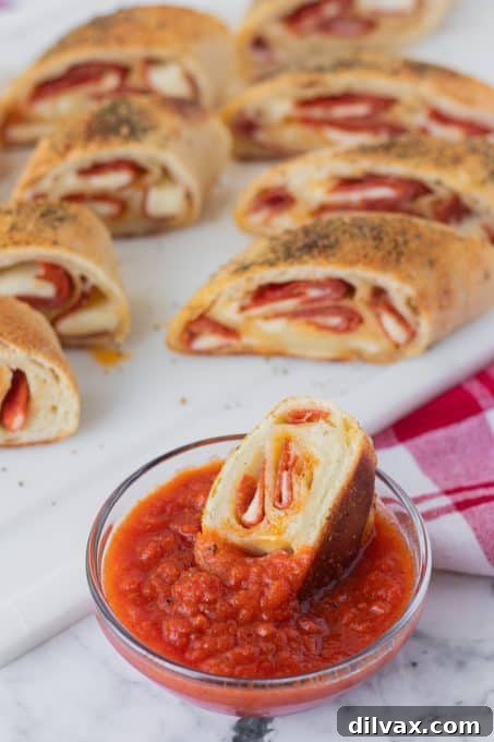 An array of delicious game day appetizers on a platter, including pepperoni bread slices ready for sharing.