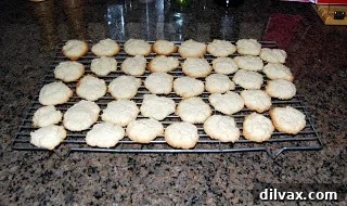 Freshly baked cream cheese cookies on a baking sheet