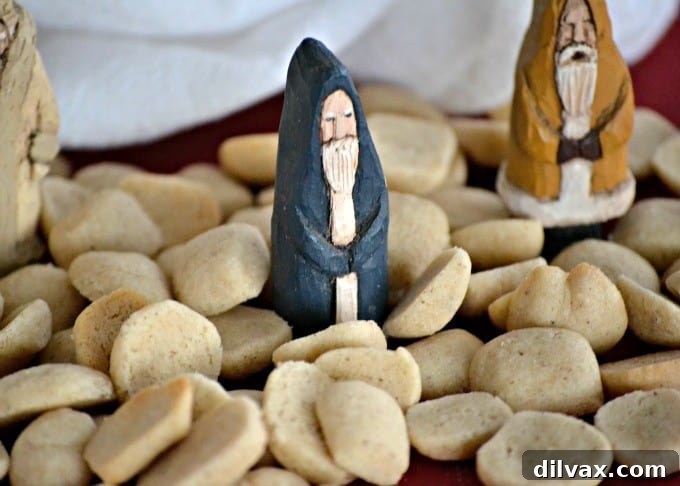 Pebernødder - Danish Christmas Spiced Cookies 4 Piles of small, round, spiced Pebernødder cookies presented on a baking sheet, showcasing their uniform size and rustic appearance.