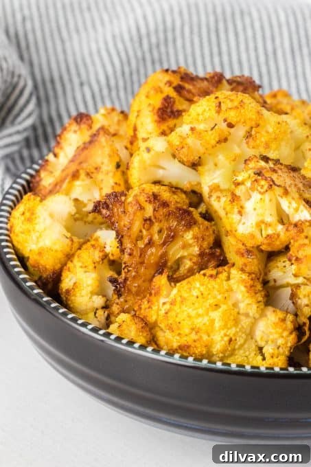 Cajun Curry Roasted Cauliflower 9 A serving of Oven Roasted Curry Cajun Cauliflower in a clean, minimalist style.