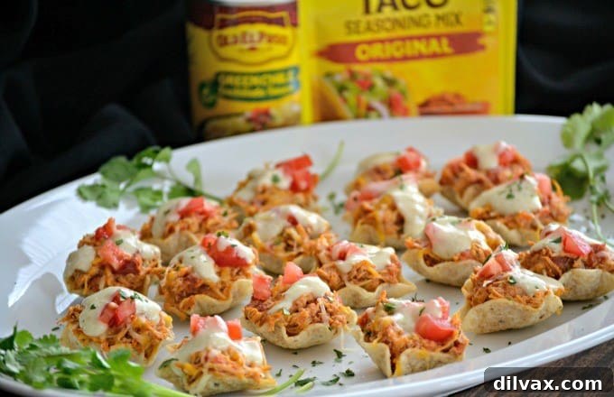 Delicious Slow Cooker Chicken Enchilada Bites with a vibrant green chile cream sauce, perfect for game day gatherings.