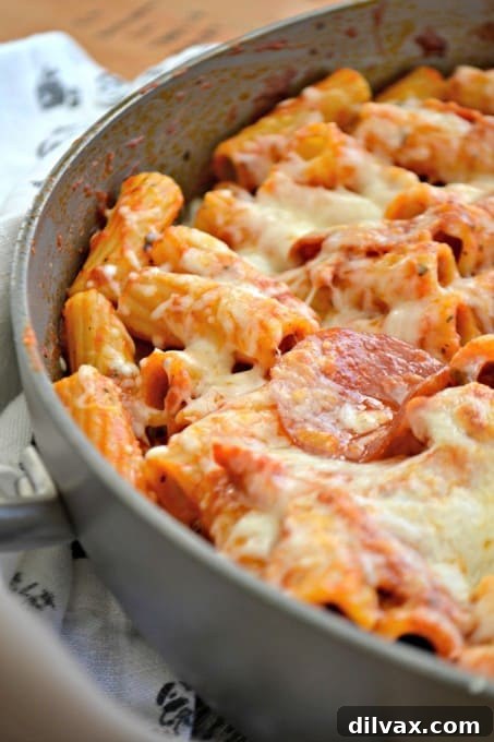 This Pepperoni Pizza Pasta is pepperoni and rigatoni mixed with a cheesy pizza sauce full of taste. It's a new alternative to pizza night!