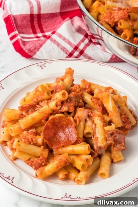 Pasta in a pizza sauce with pepperoni and mozzarella cheese.