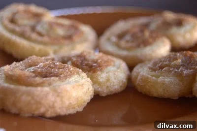 Crispy Cinnamon Sugar Palmiers, lightly dusted with sugar, perfect for coffee breaks.