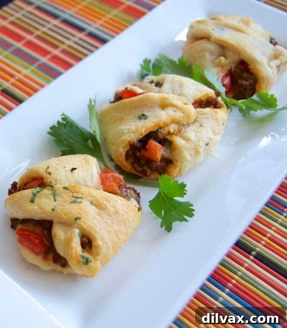 Golden-brown Taco Pockets, filled with a savory taco mixture, perfect for parties.