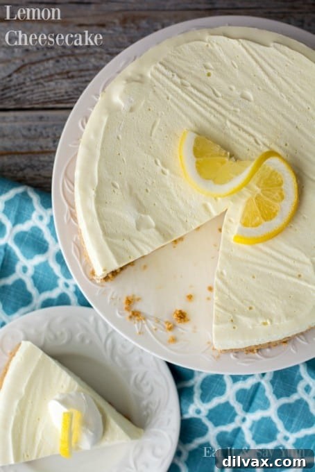 A pristine slice of no-bake lemon cheesecake on a white plate, ready for serving during warm spring and summer months