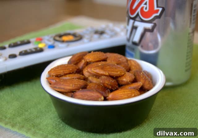 A bowl of perfectly baked almonds, coated with a delicious blend of spices.