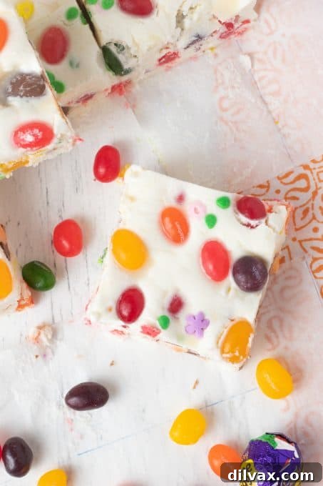 Colorful Easter Fudge 7 Top-down view of white fudge with colorful Starburst jelly beans pressed into the surface, creating a vibrant and appealing Easter treat.