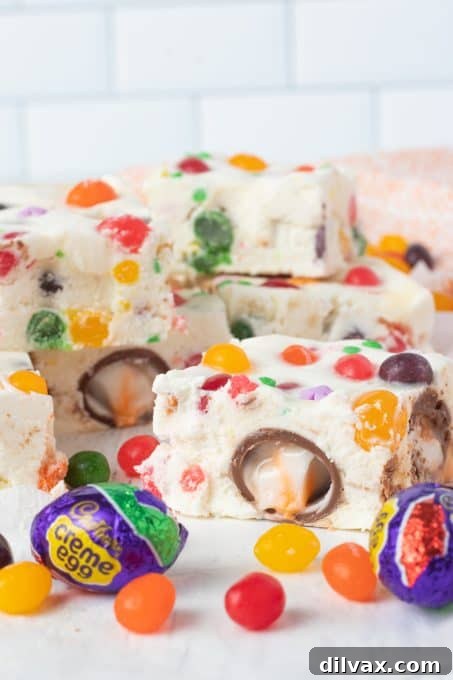 Colorful Easter Fudge 10 A beautifully presented slab of Easter Fudge, adorned with colorful candies, perfect for a holiday centerpiece.