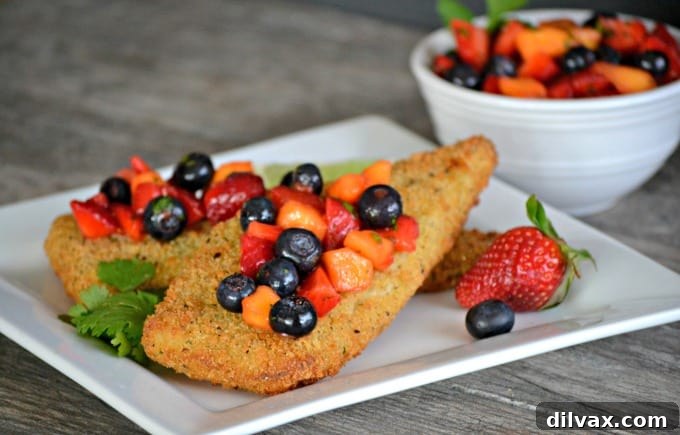 Crispy Parmesan Cod with Fresh Berry Salsa 2 Parmesan crusted Cod accompanied by a fresh strawberry, blueberry and mango salsa - a delicious and easy dinner that's ready in under 30 minutes!