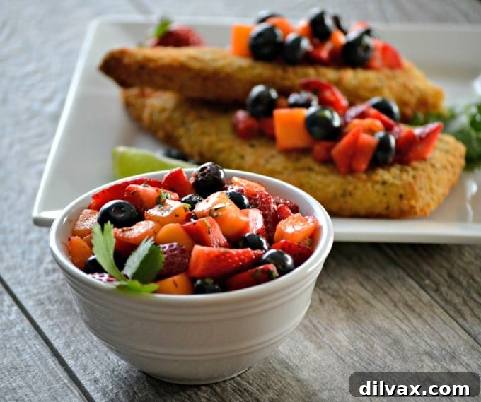 Crispy Parmesan Cod with Fresh Berry Salsa 8 Parmesan crusted Cod accompanied by a fresh strawberry, blueberry and mango salsa - a delicious and easy dinner that's ready in under 30 minutes!