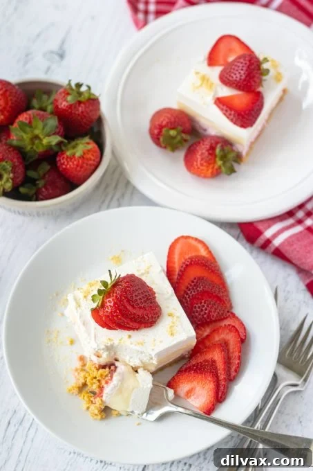 Perfectly sliced Strawberry Cheesecake Bars revealing all the delicious layers