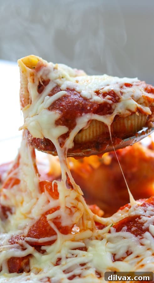 Close-up of Pepperoni Pizza Stuffed Shells, showing the rich filling and melted cheese, ready to be served.