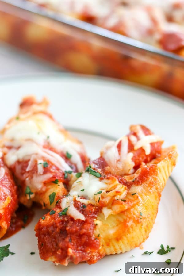 A dish of Pepperoni Pizza Stuffed Shells, garnished with fresh herbs, showcasing its appetizing appeal.