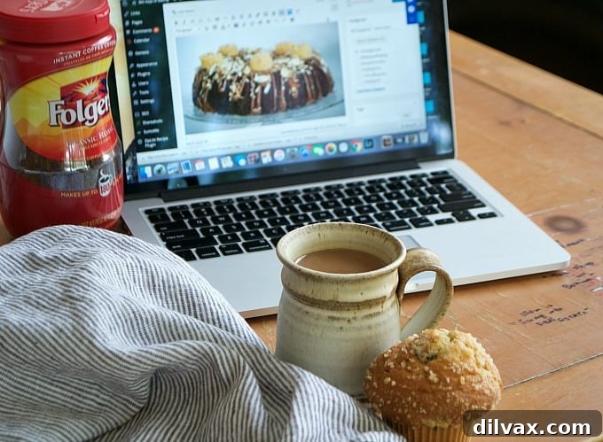 Four cups of coffee on a wooden table, suggesting shared moments