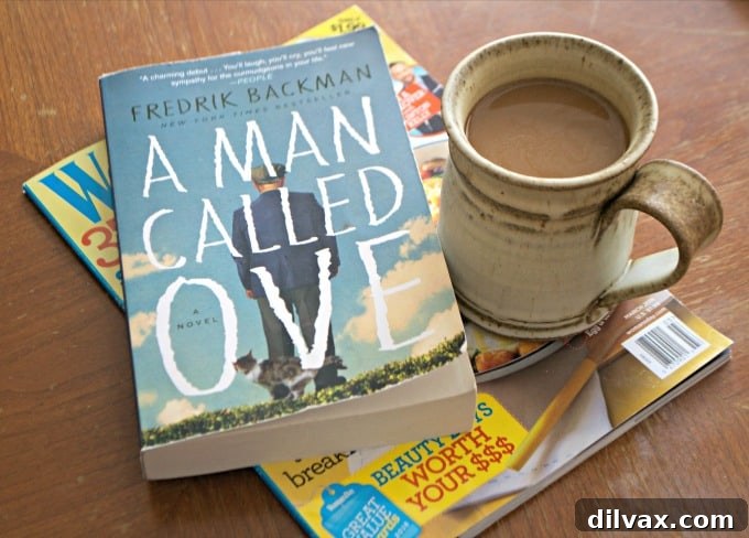 A hand holding a cup of Folgers instant coffee