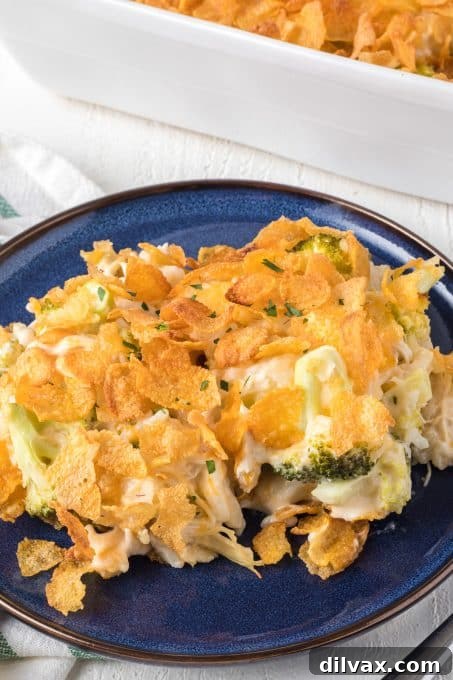 Close-up of a serving of Cheesy Chicken, Broccoli, and Rice Casserole with crispy cornflake topping.