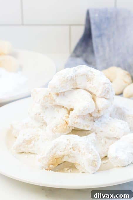 A generously sized plate brimming with delicate Viennese almond crescents.
