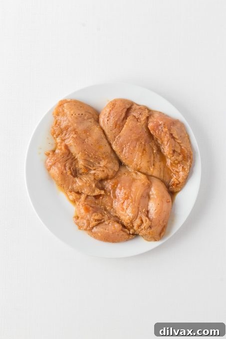 Foolproof Chicken Marinade 4 Chicken breasts marinating, ready to be grilled to perfection.